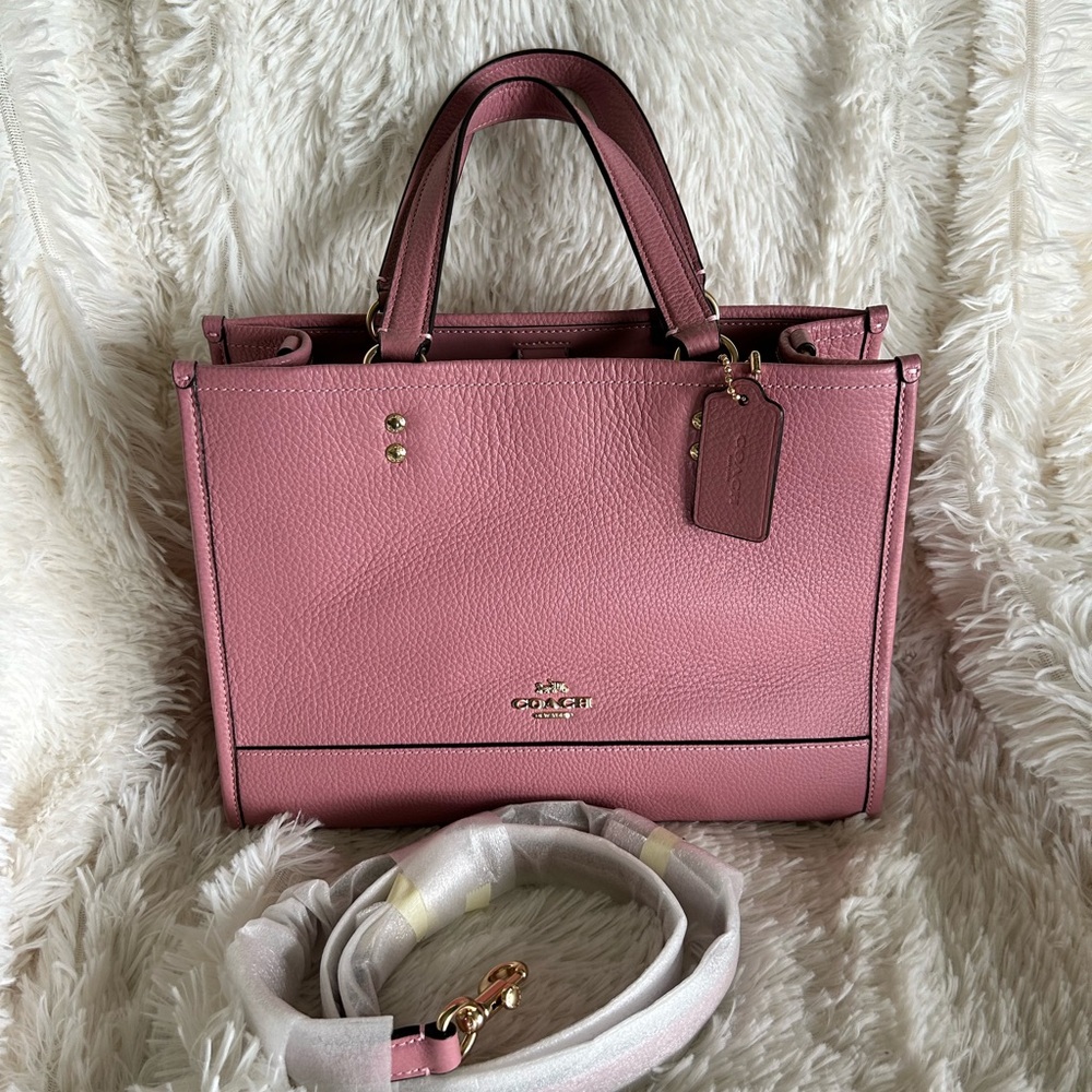 Coach Dempsey carryall in true pink color. Matching long strap